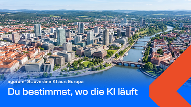 Luftaufnahme eines europäischen Geschäftsviertels mit Fluss und Brücken, darüber der Titel Du bestimmst, wo die KI läuft